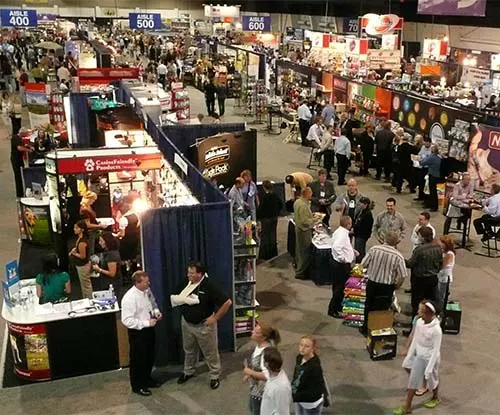 Overhead view of people at a large trade show or expo