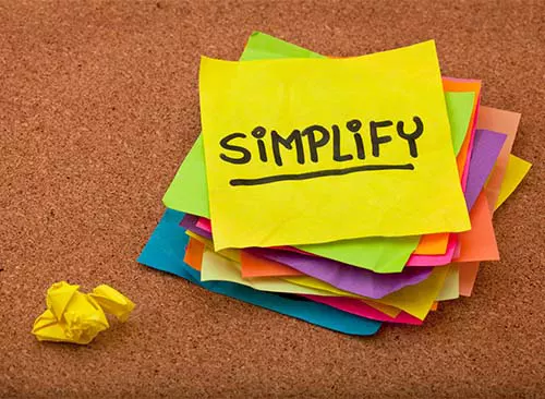 stack of colorful sticky notes on cork bulletin board