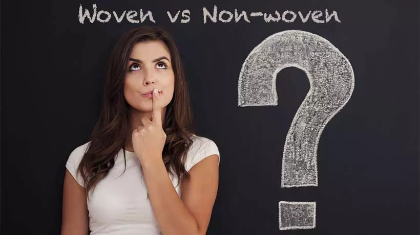 Woman whimsically thinking front of a chalkboard about Woven vs Non-Woven Polypropylene Bags