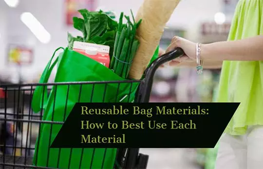 Person pushing black shopping cart with green reusable bag holding groceries