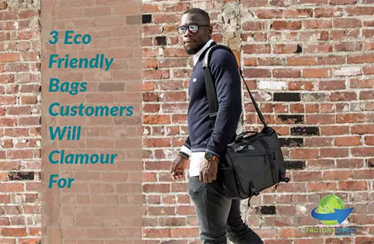 Stylish man in reflective sunglasses walking in front of a brick wall carrying a messenger bag by shoulder strap.