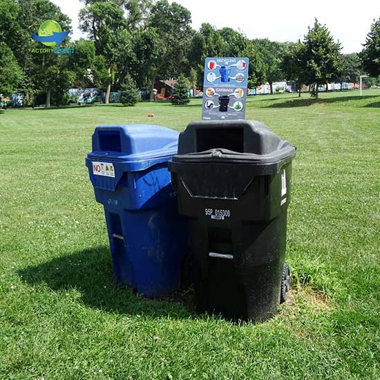 Recycling receptacles in an open field discouraging Wishcycling