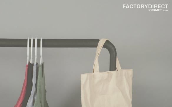 Close-up of mostly empty rack of hanging clothes