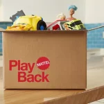 mattel playback cardboard box sitting on wood table