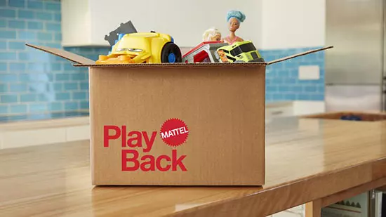 mattel playback cardboard box sitting on wood table