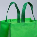 Isolated Lime green reusable shopping bag — Help promote your marketing brand