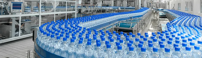 Large-scale manufacturing of single-use plastic water bottles.