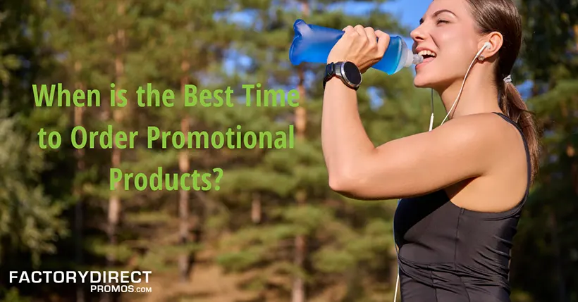 woman on an outdoor hike drinking from reusable water bottle.